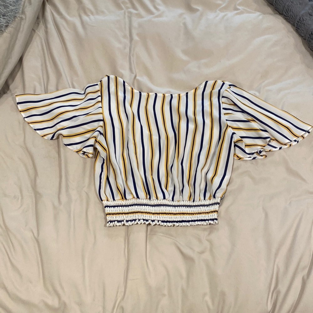 Blue and yellow striped blouse with cinched waist and tie back